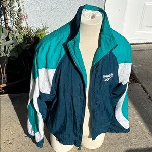 Reebok SZ M Women's Teal and Dark Blue wind breaker Jacket.